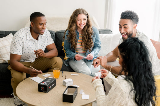 Hot Seat card draw round table setup encouraging playful prompts