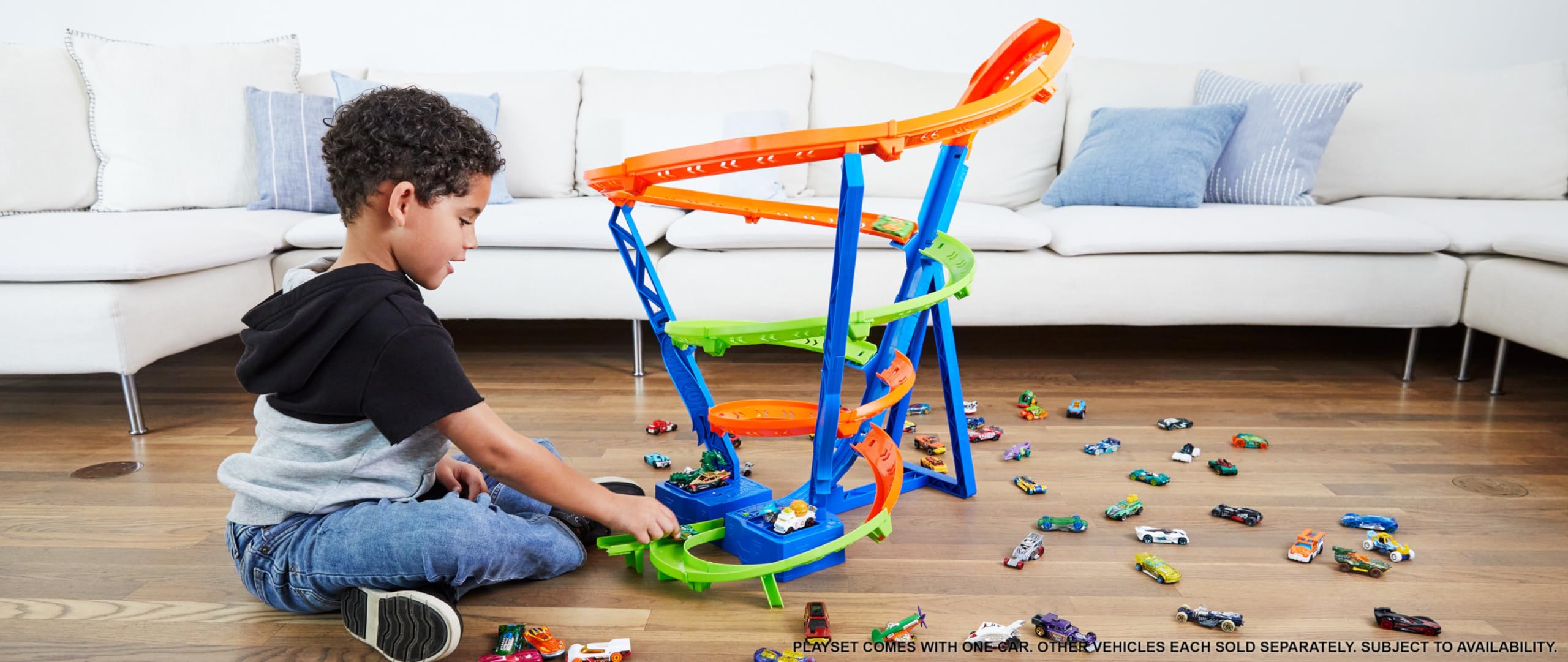 Hot Wheels booster launches cars up the track for thrilling climbs.