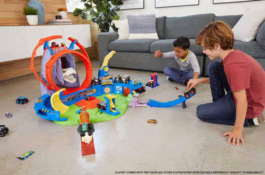 Hot Wheels Monster Trucks dinosaur nemesis challenges trucks in erupting action.