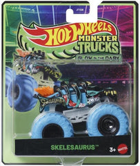 Hot Wheels Skelesaurus glow-in-the-dark monster truck, 1:64 scale, dramatic night-time display.