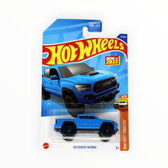 Hot Wheels Toyota Tacoma 2020 blue side view, ideal for collection desks.