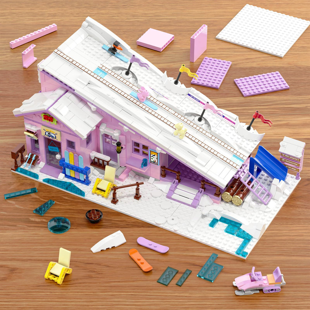 Kids assembling the HSANHE pink ski resort house for collaborative building.