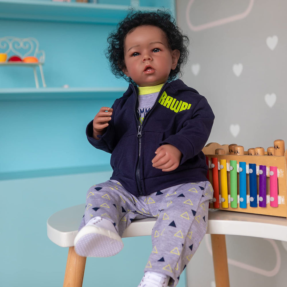 iCradle Reborn Boy Doll outfit showcase for versatile play looks.