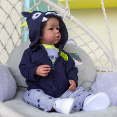 iCradle Reborn Boy Doll magnet pacifier in use for soothing play.