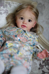 iCradle realistic doll with cloth body and soft vinyl limbs for gentle handling.