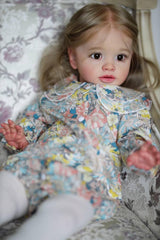 iCradle reborn toddler girl features detailed brown hair and lashes for realism.