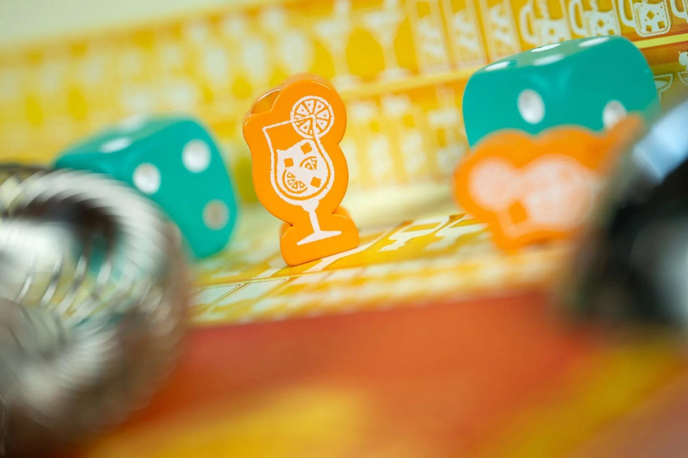 IELLO Pina Coladice dice-rolling action captures exciting gameplay moments.