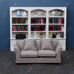 iland dollhouse sofa with wavy profile—handcrafted finish and elegant silhouette.