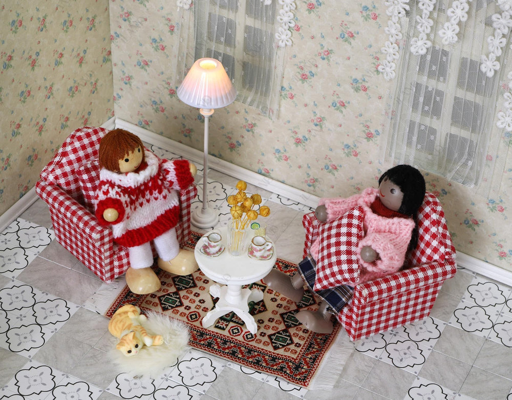 iland dollhouse close-up stitching highlights hand-sewn sofa details.