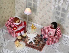 iland dollhouse close-up stitching highlights hand-sewn sofa details.