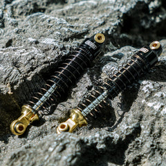 INJORA 59mm shocks installation image demonstrates easy upgrade for RC crawler builds.