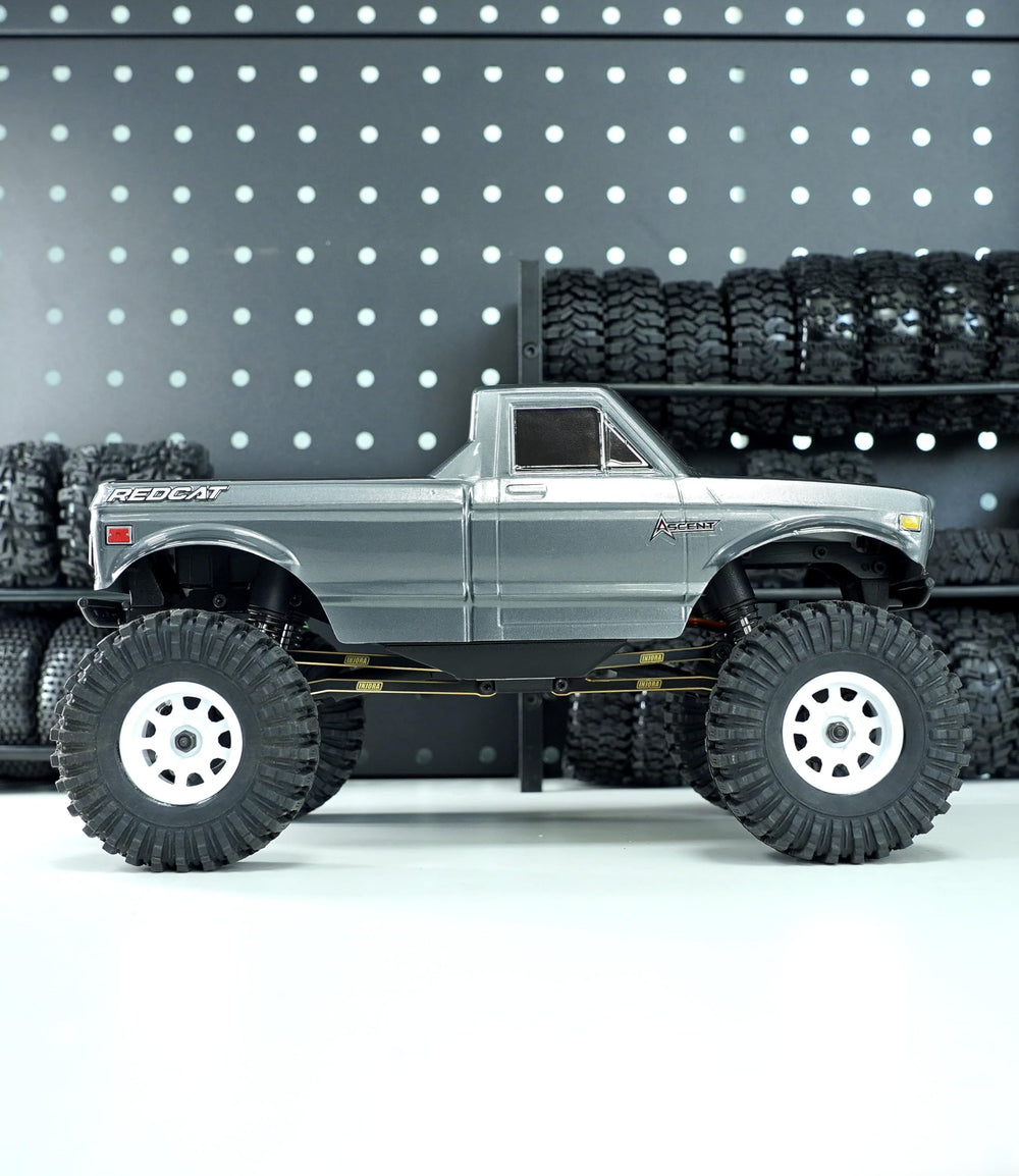 INJORA black-coated hardware highlights rugged build.