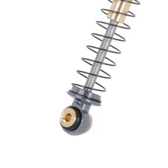 Double-barrel INJORA shocks showing telescopic design for smooth damping.