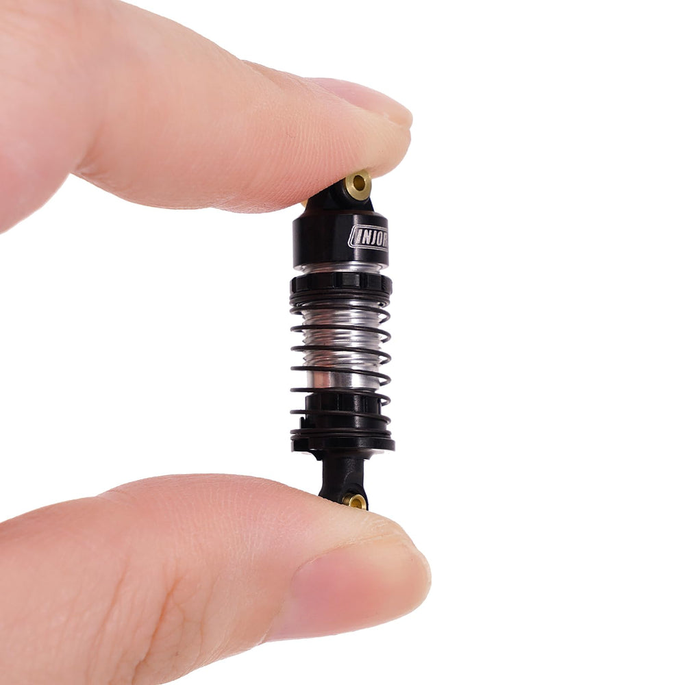 INJORA included springs for front and rear provide setup variety.