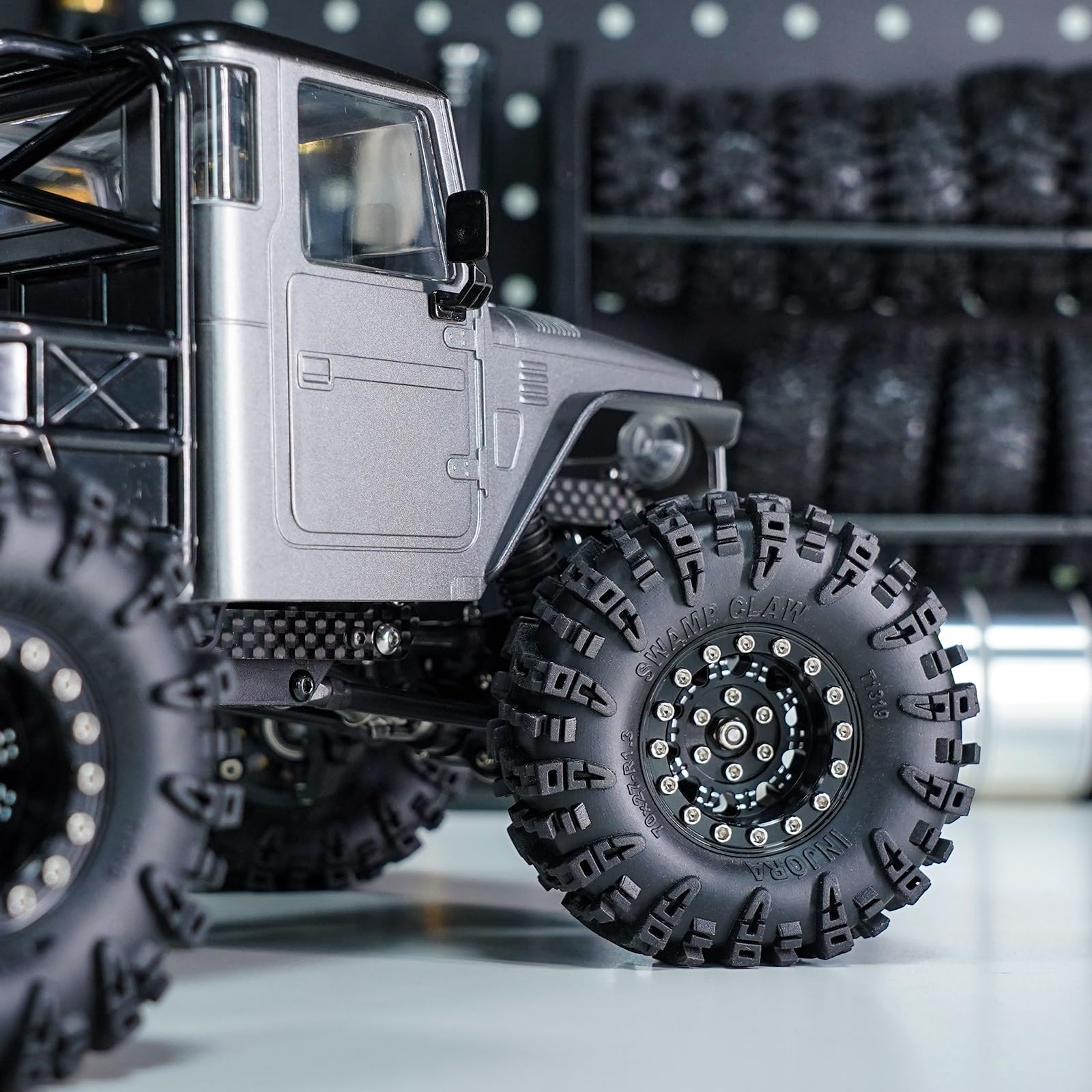INJORA RC crawler setup shot with wheels installed.