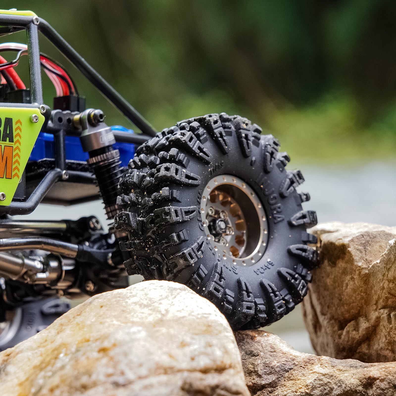 INJORA Swamp Claw 1.0 tire performing on mud and loose soil.