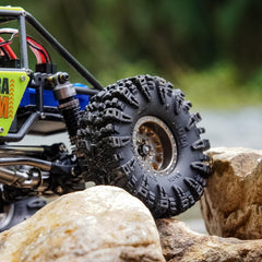 INJORA Swamp Claw 1.0 tire performing on mud and loose soil.