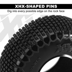 INJORA tire closeup reveals XHX pins and grip-ready texture.