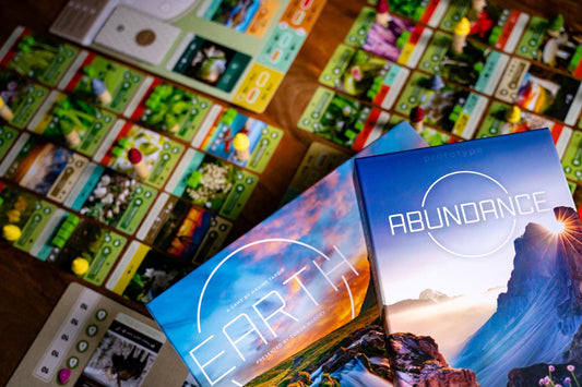 Inside Up Games Earth: Abundance sprout card unlocks growth options.
