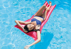 Intex Relax-A-Mat in water with one mat ready for lounging.
