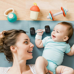 iPlay gym rattle barbell teether offers textured surfaces for soothing teething moments.