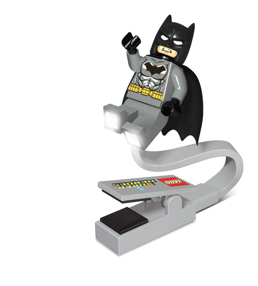 IQ Batman Book Light clipped to a book for bright, portable reading.