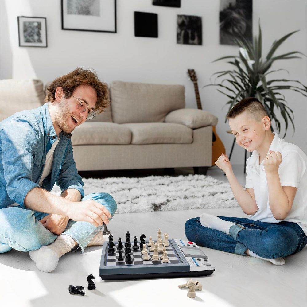 ISEE iCore adults enjoying family chess night with interactive tutoring