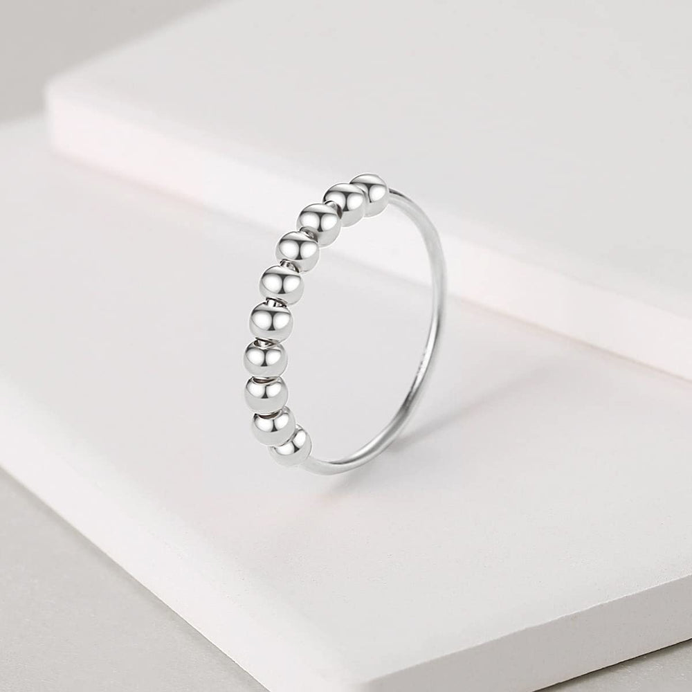 Jacruces sterling silver anxiety ring band detail highlights minimalist design for daily wear.