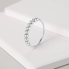 Jacruces sterling silver anxiety ring band detail highlights minimalist design for daily wear.