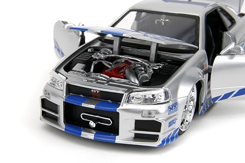 Jada Skyline R34 engine compartment reveals intricate components in a compact scale.
