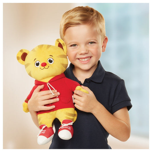 Press Daniel's paw to hear friendly phrases and songs for playful learning.
