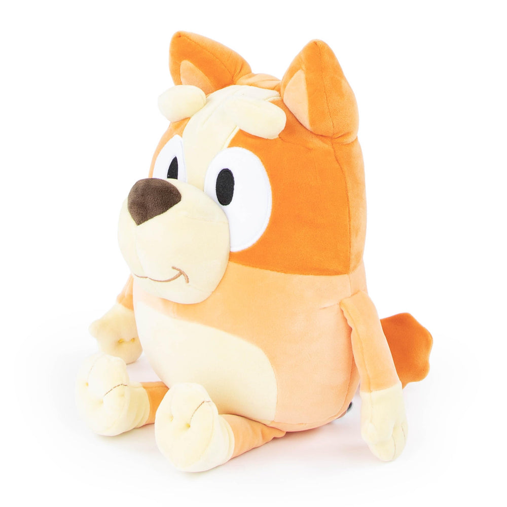 Child hugs Jay Franco Bluey Bingo pillow buddy during playtime