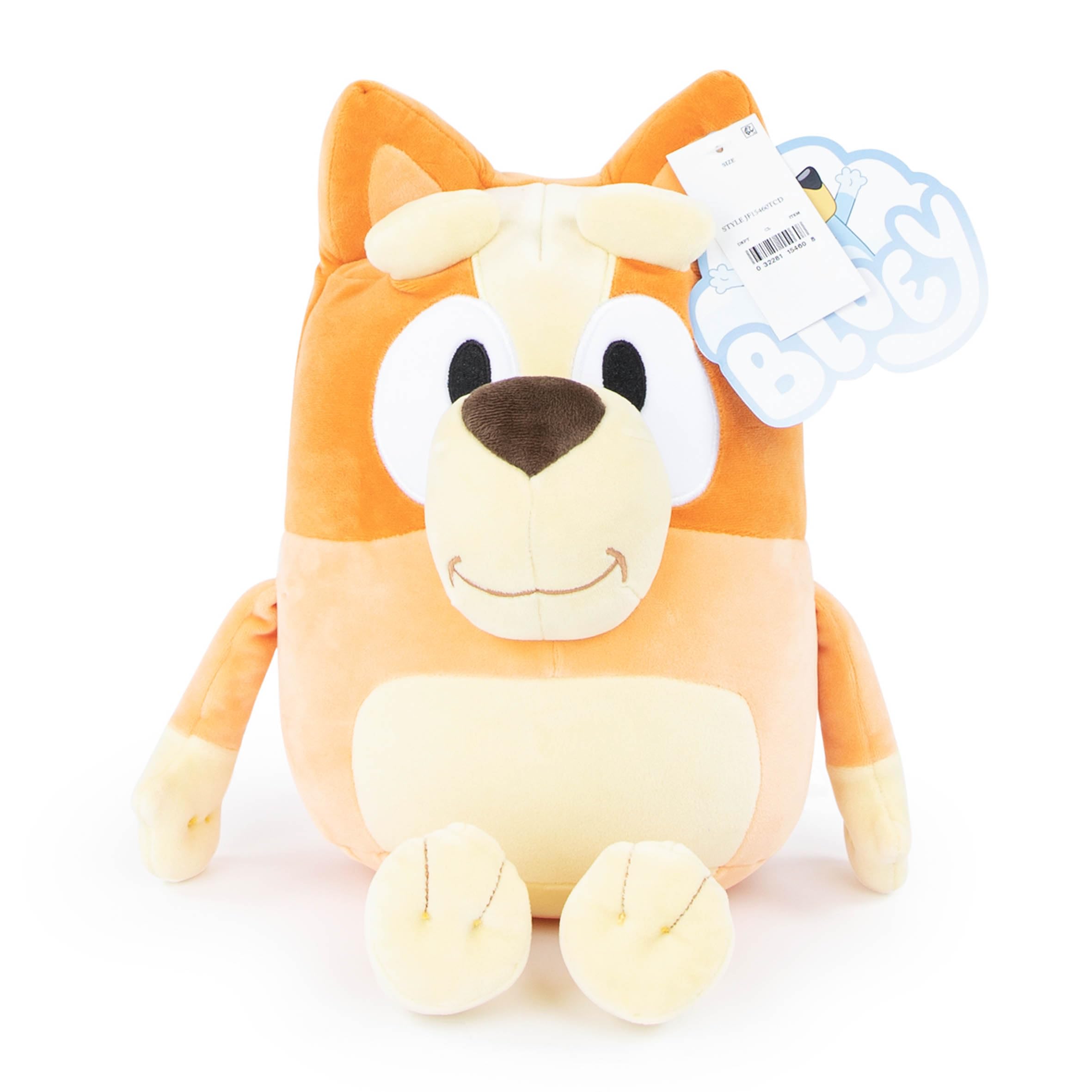Bluey Bingo pillow buddy ready to travel beside a backpack