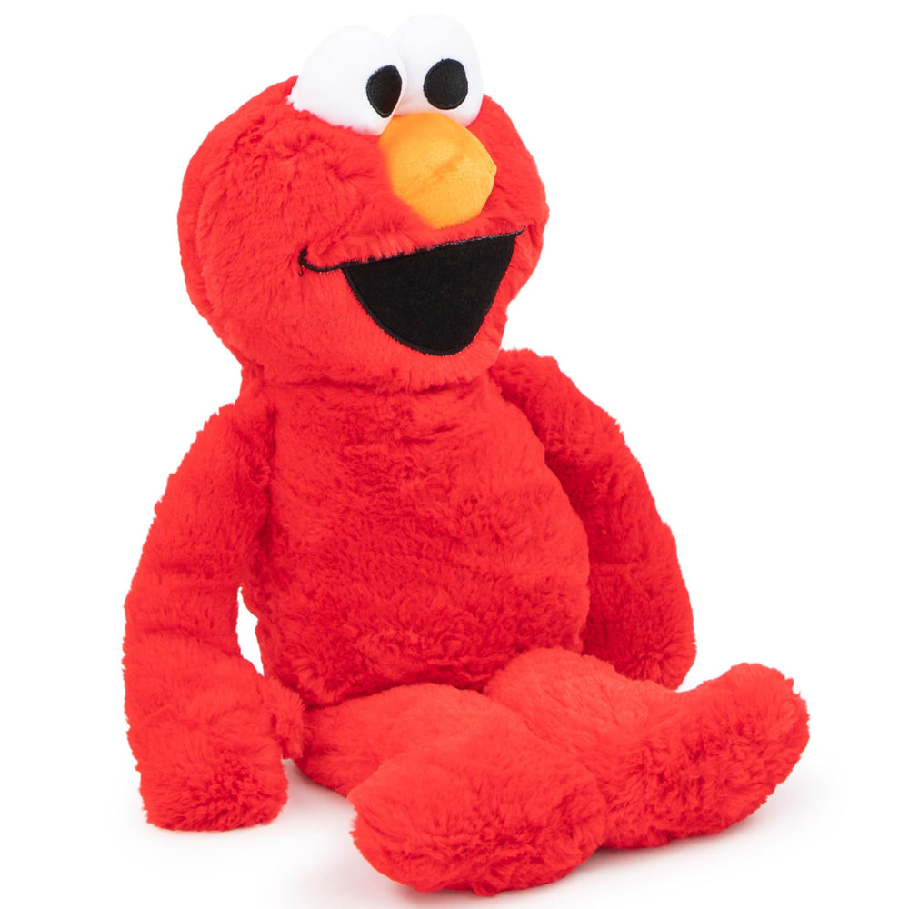 Jay Franco Sesame Street Elmo pillow in bed ready for bedtime snuggles.