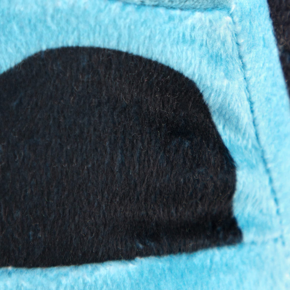 Side view of the Jay Franco Megalodon plush pillow highlighting its compact size.