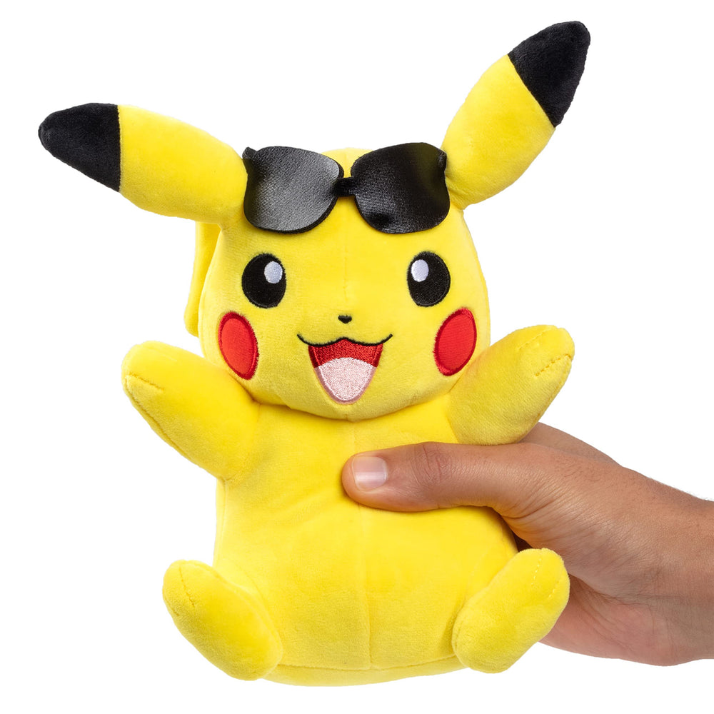 Jazwares Pikachu plush beside a child, encourages imaginative Pokémon adventures