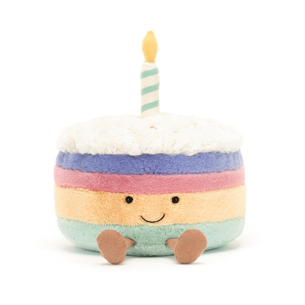 Lush Jellycat Rainbow Birthday Cake design with suede candle accent, desk companion.