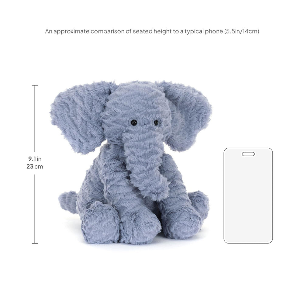 Jellycat Fuddlewuddle Elephant perched on bed or shelf as comforting decor