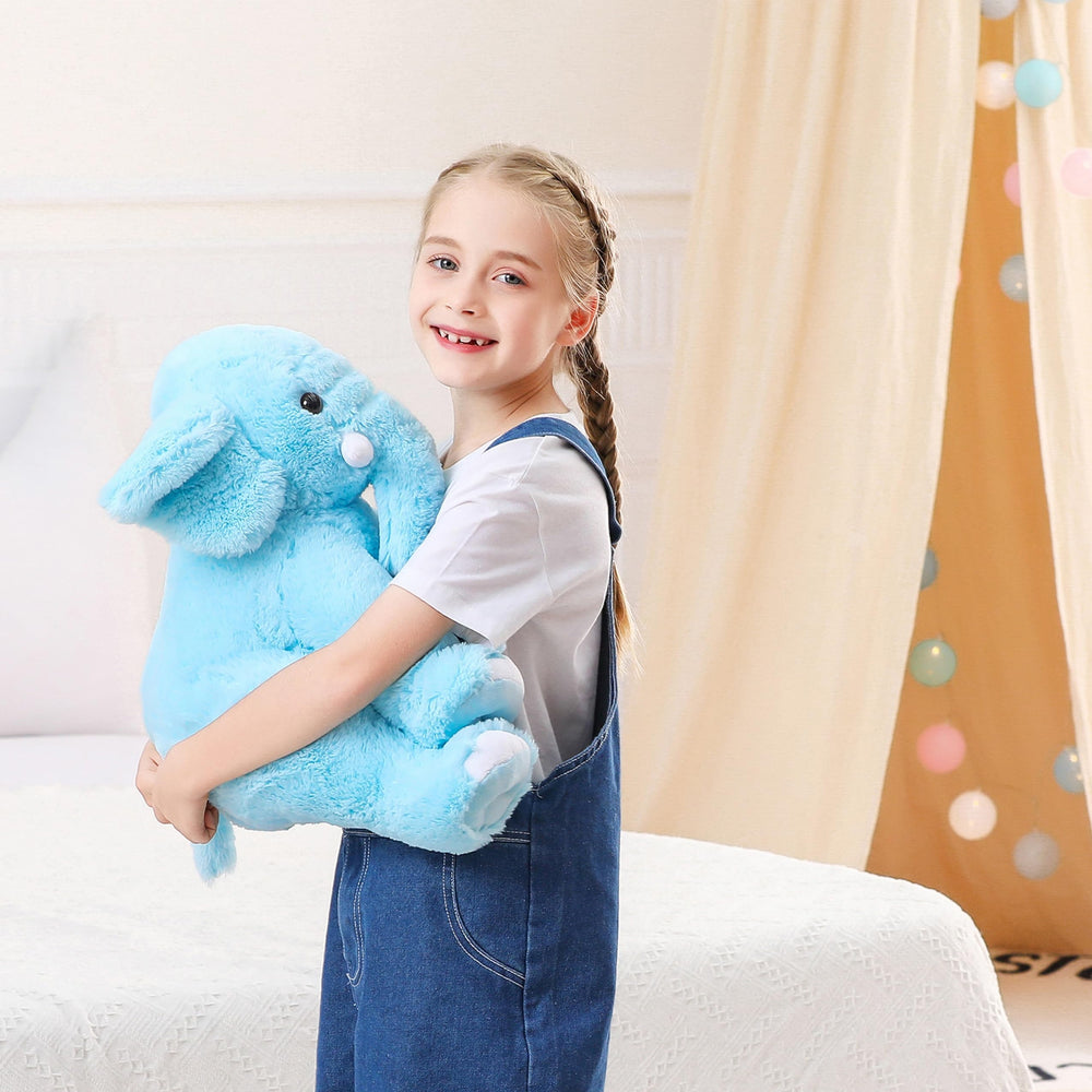 JellyMallow Elephant 16-inch weighted plush used as a cuddle pillow on sofa