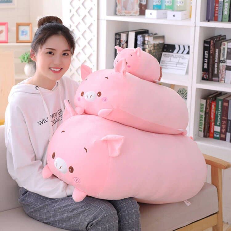 Jensquaify pig plush pillow on a sofa adds cute decor and comfort.