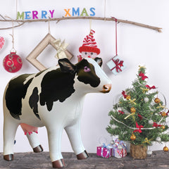 Jet Creations cow inflatable features artistic design with vibrant color palette.