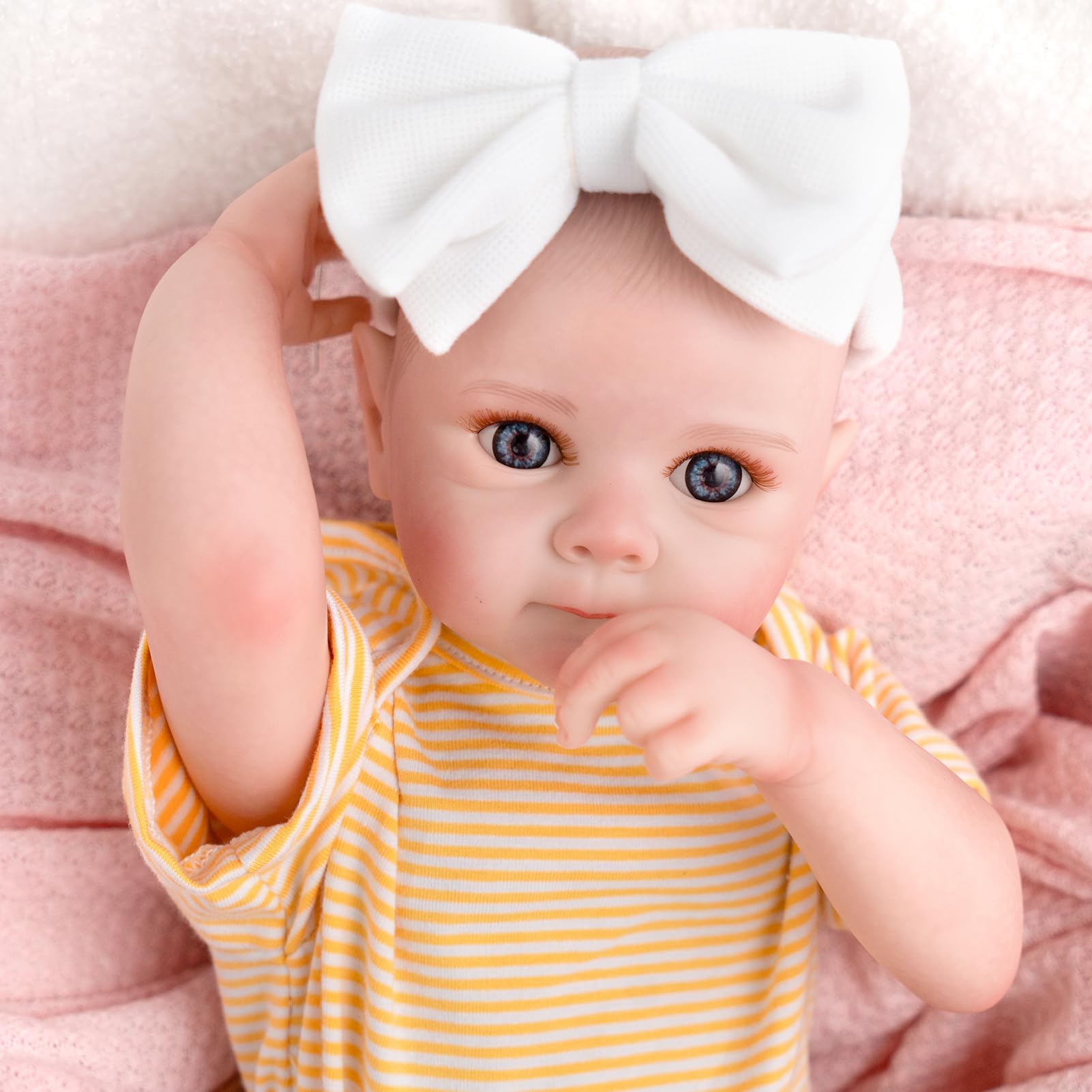Jirachi doll wearing yellow striped top with brown floral pants for cheerful styling.
