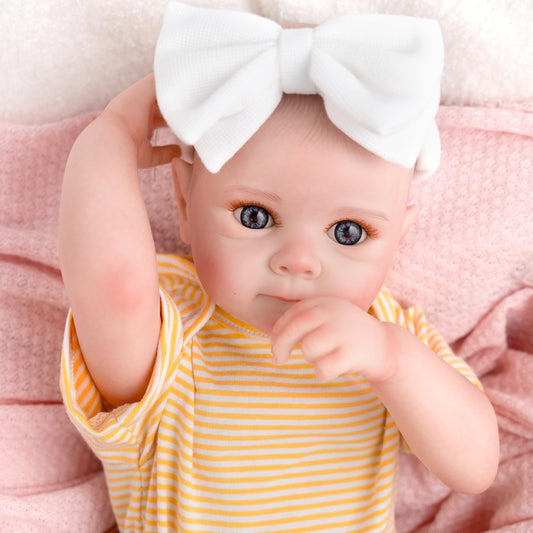 Jirachi doll wearing yellow striped top with brown floral pants for cheerful styling.