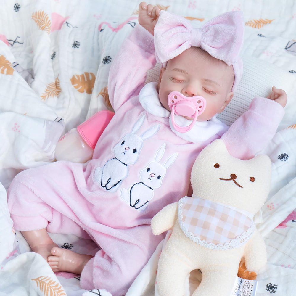 Jirachi 18-inch reborn doll front view in pink outfit, inviting cuddles and imaginative play