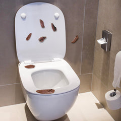 Jishi Poop Slingshot sticks to walls with no lasting residue.