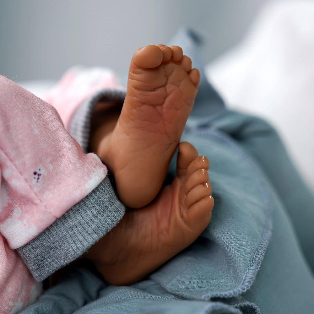JIZHI lifelike reborn doll fully poseable with cloth body for dynamic play.