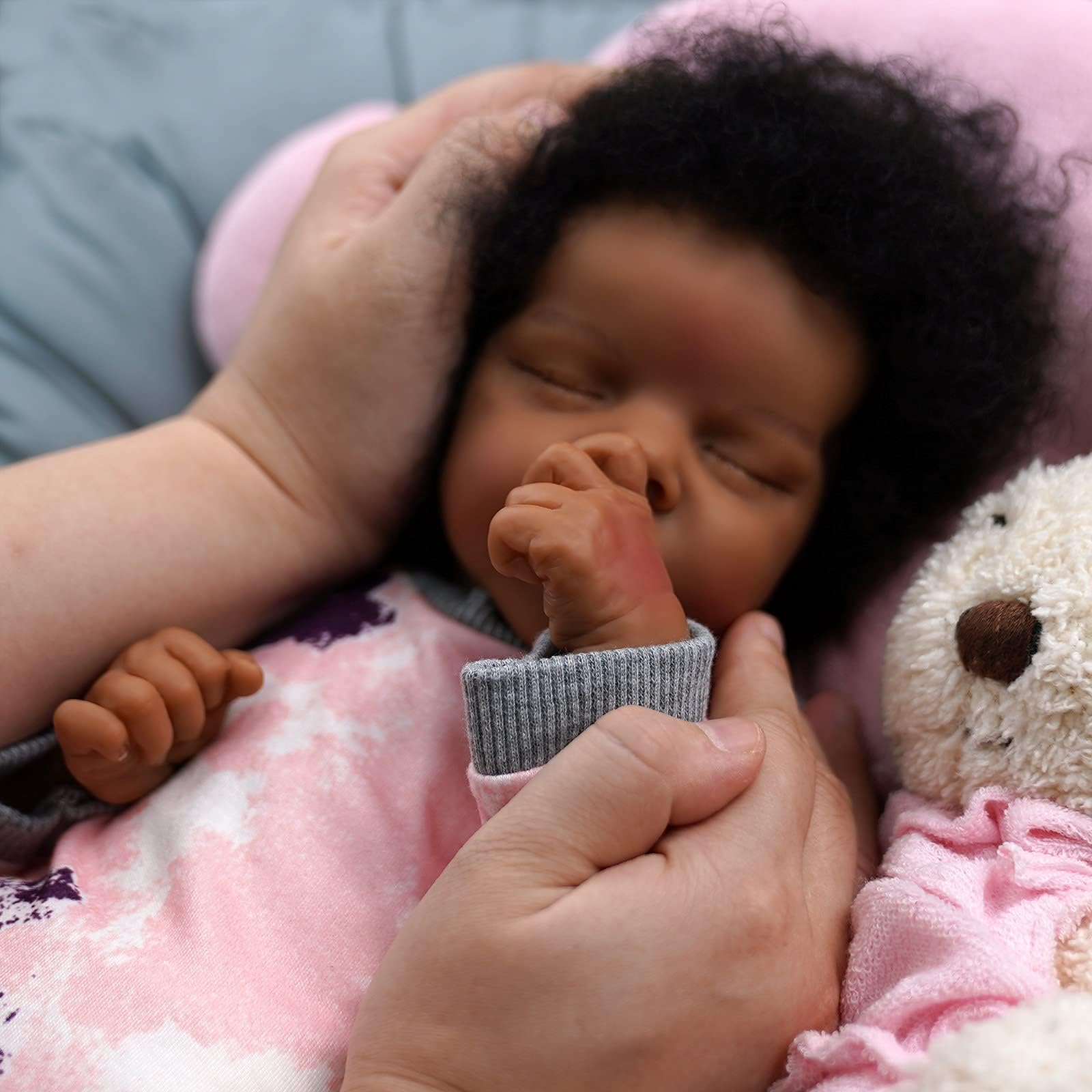 JIZHI reborn doll newborn-size outfits ready for easy dressing.
