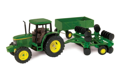 John Deere 6410 tractor toy with die-cast body and free-rolling wheels for realistic play.