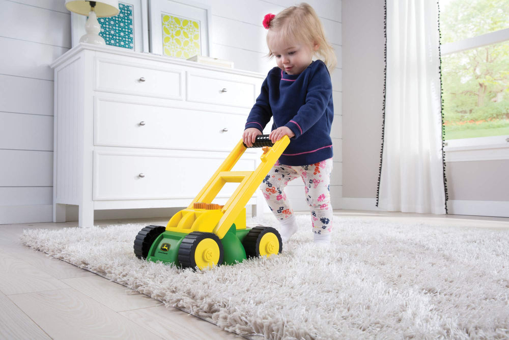 John Deere mower shows rotate grass clippings for realistic outdoor play.