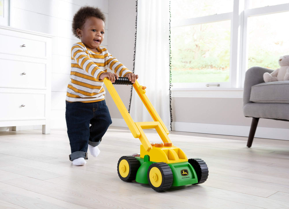 John Deere mower has spinning blade detail for lifelike mowing action.